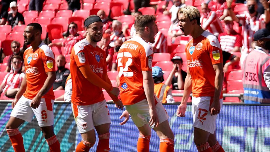 Kenneth Dougall celebrates with his Blackpool teammates