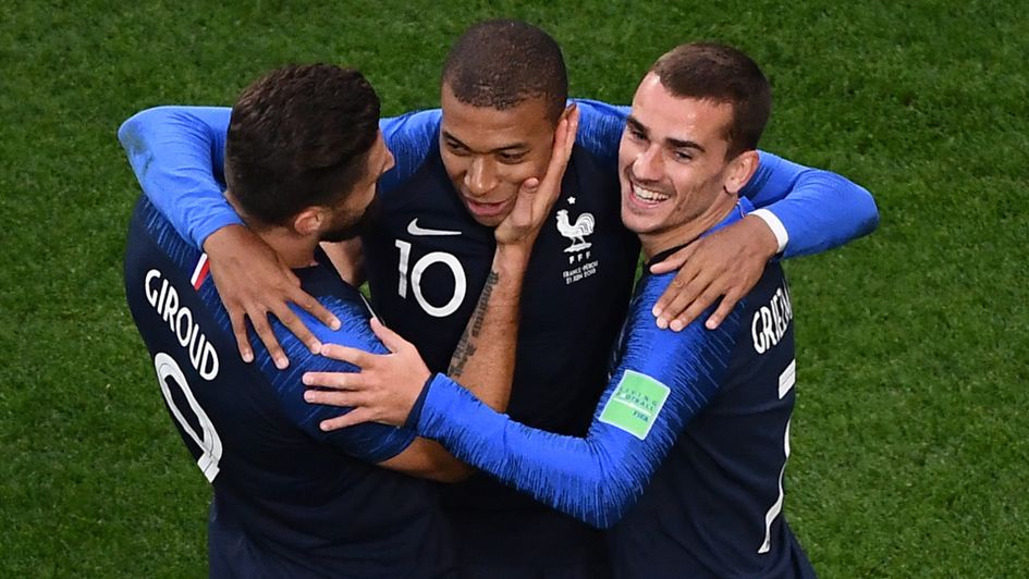 Olivier Giroud (left) and Antoine Griezmann (right) celebrate Kylian Mbappe's goal for France at the World Cup