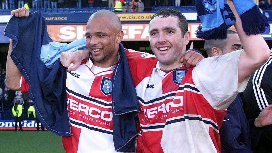 Wycombe goalscorers Paul McCarthy (right) and Roy Essandoh celebrate victory over Leicester in 2001