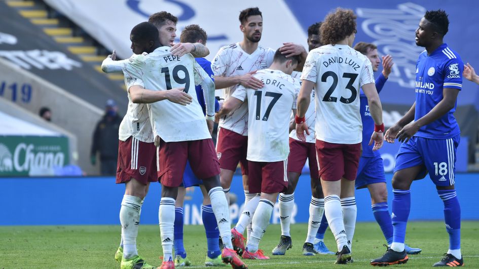 Arsenal's Nicolas Pepe embraces team-mate Granit Xhaka after victory over Leicester