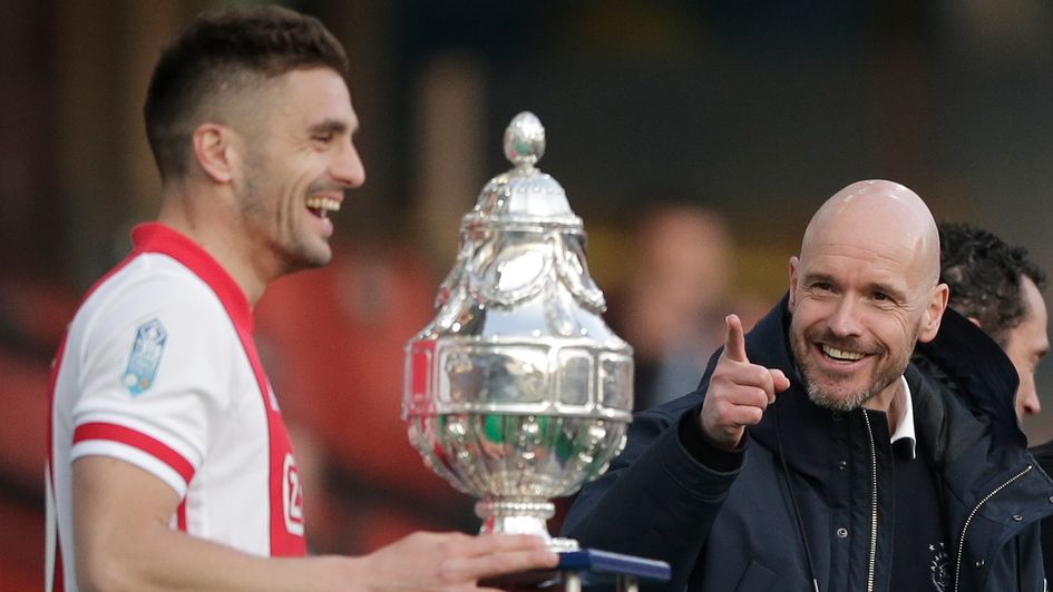 Erik ten Hag gestures as captain Dusan Tadic is about to lift the KNVB Cup