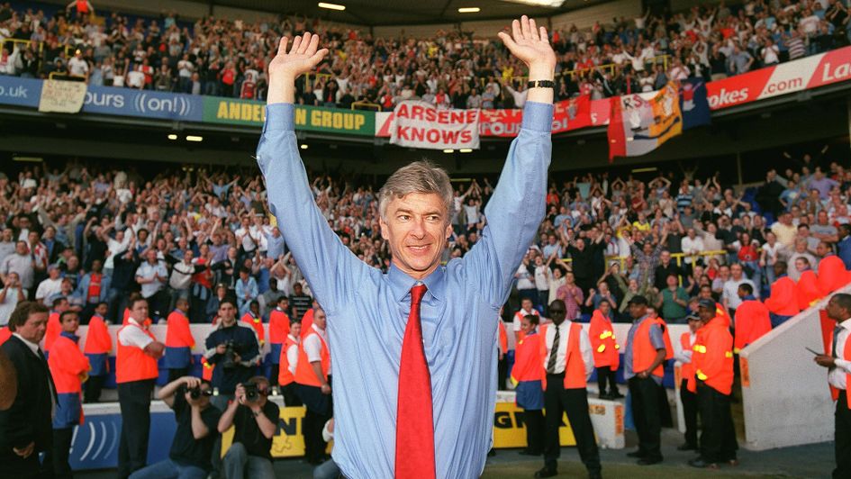 Arsene Wenger celebrates in front of Arsenal fans in 2004