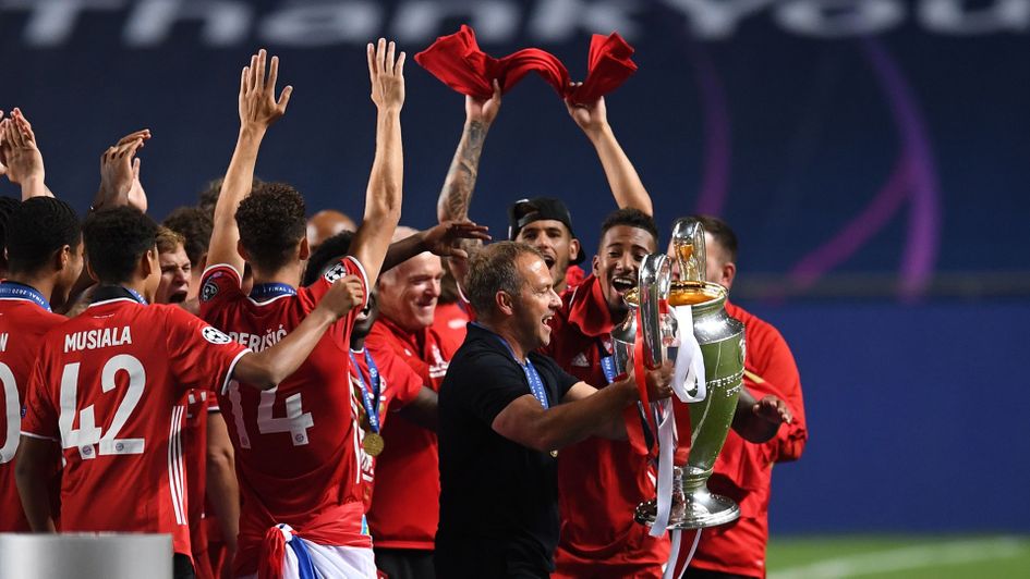 Hansi Flick lifts the Champions League trophy