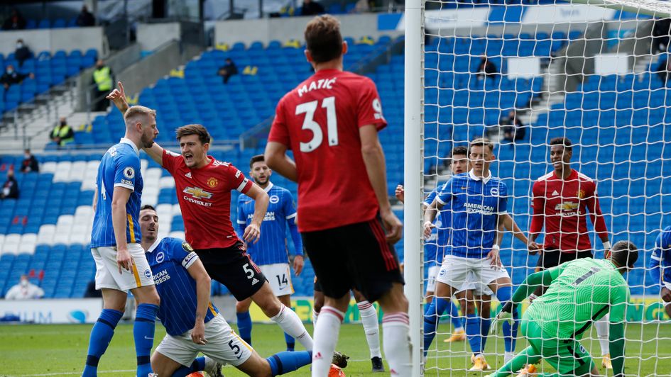 Harry Maguire celebrates Manchester United's equaliser at Brighton