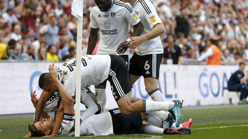 Fulham players celebrate with Tom Cairney after his goal in the Sky Bet Championship play-off final.