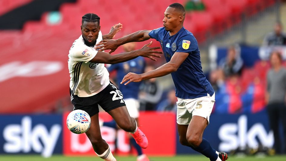 Fulham's Josh Onomah looks to escape Brentford's Ethan Pinnock in the Sky Bet Championship play-off final