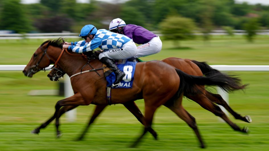 Maria Branwell (blue and white checks) powers home to win the National Stakes