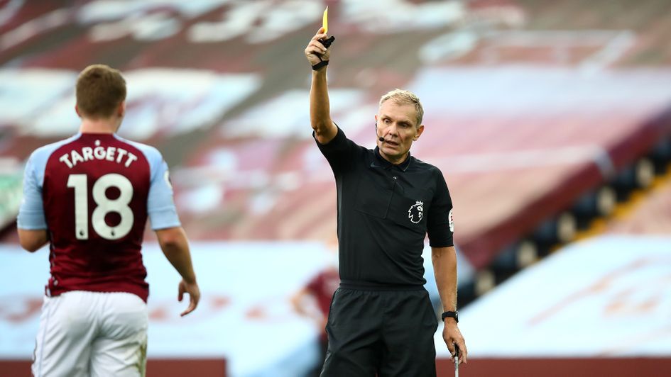 Matt Targett is shown a yellow card