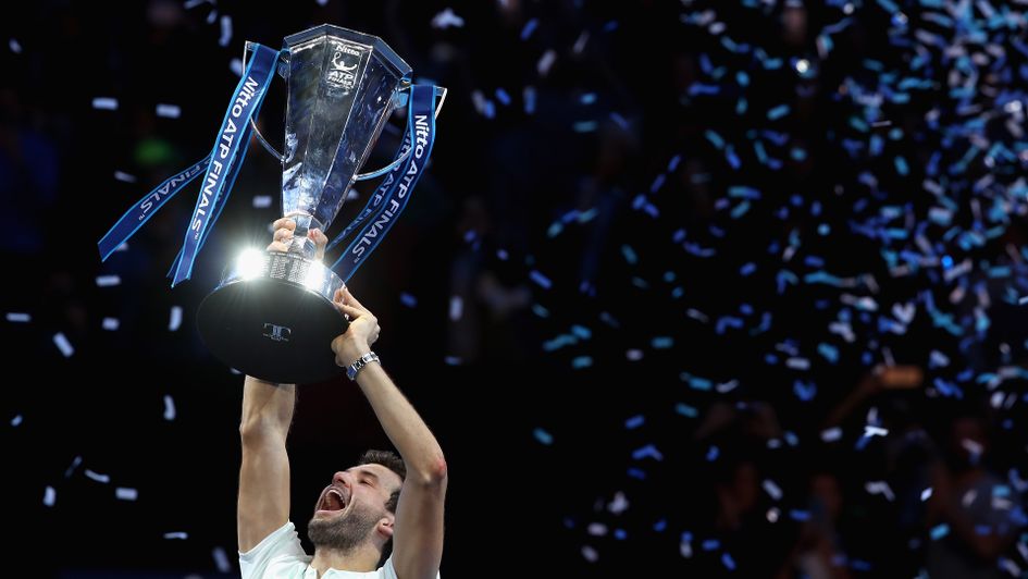 Grigor Dimitrov gets his hands on the trophy