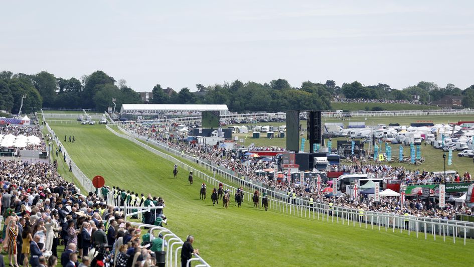 Runners and riders in the Woodcote at Epsom