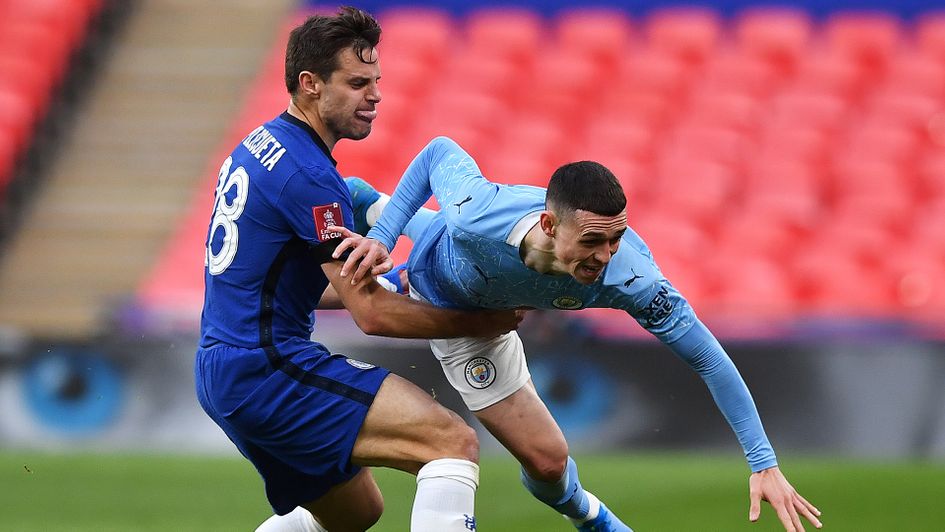 Cesar Azpilicueta looks to stop Phil Foden