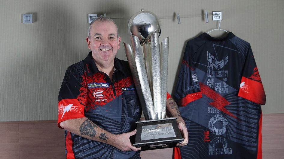 Phil Taylor with the World Darts Championship trophy (Picture: Lawrence Lustig/PDC)
