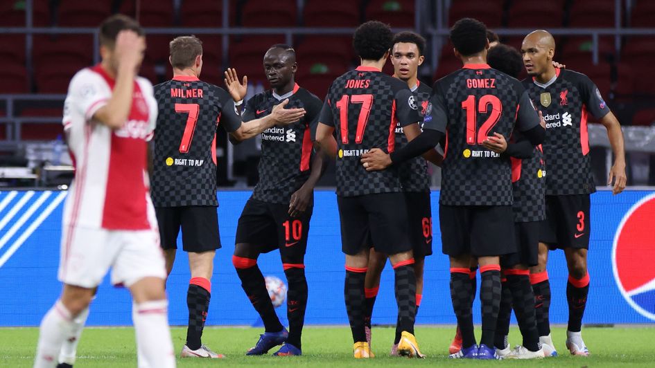 Liverpool celebrate during their clash with Ajax