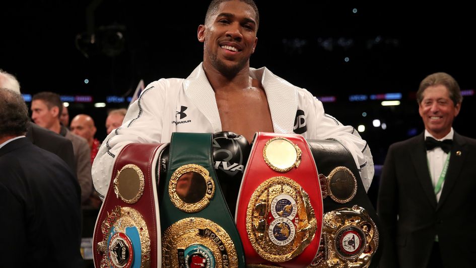 Anthony Joshua with his growing collection of belts