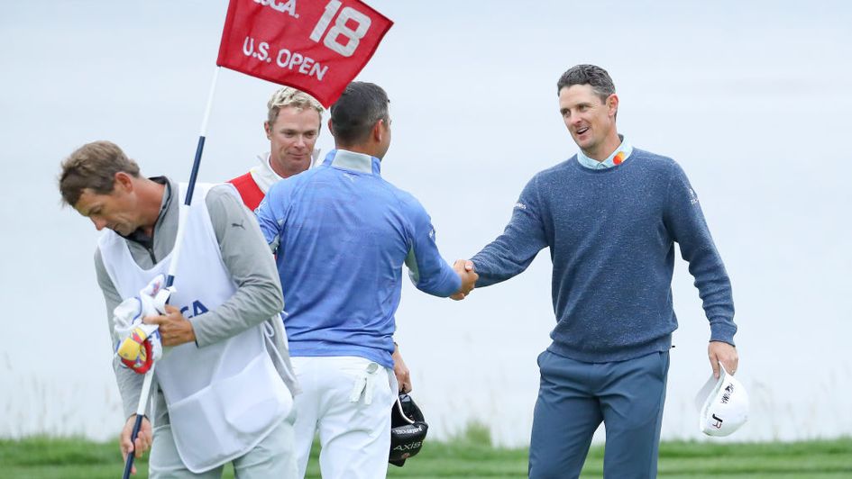 Gary Woodland and Justin Rose shake hands