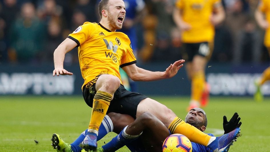 Diogo Jota is fouled by Leicester City's Portuguese defender Ricardo Pereira