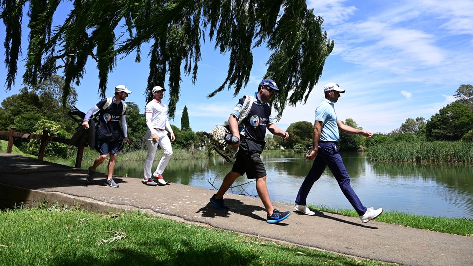 Charl Schwartzel (right) strides into the lead