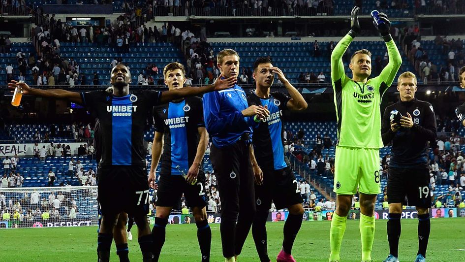 Club Brugge celebrate after earning a 2-2 draw at Real Madrid