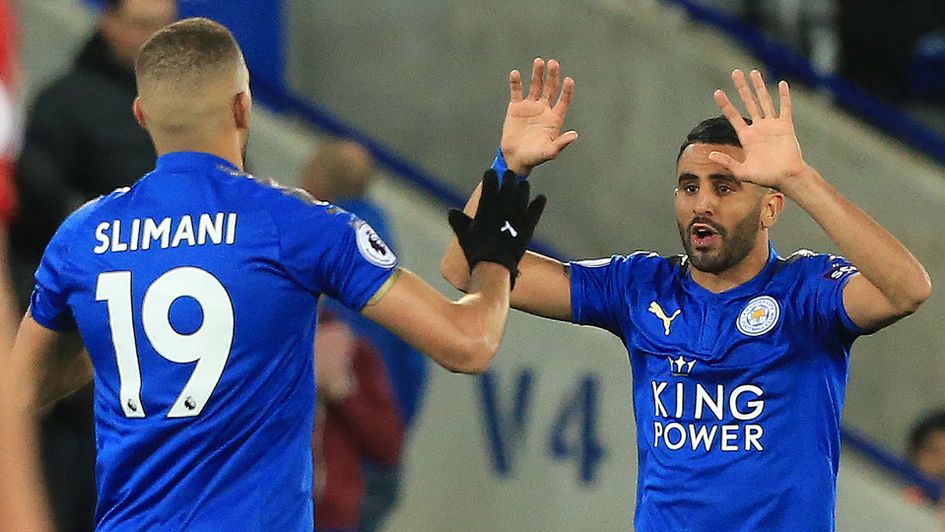 Islam Slimani and Riyad Mahrez celebrate