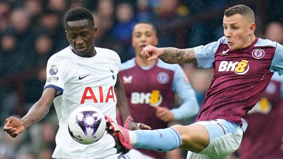 Tottenham Hotspur's Pape Matar Sarr (left) and Aston Villa's Lucas Digne battle for the ball