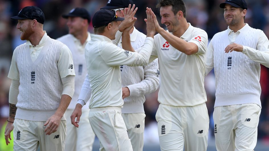 England celebrate after Toby Roland-Jones removes Hashim Amla