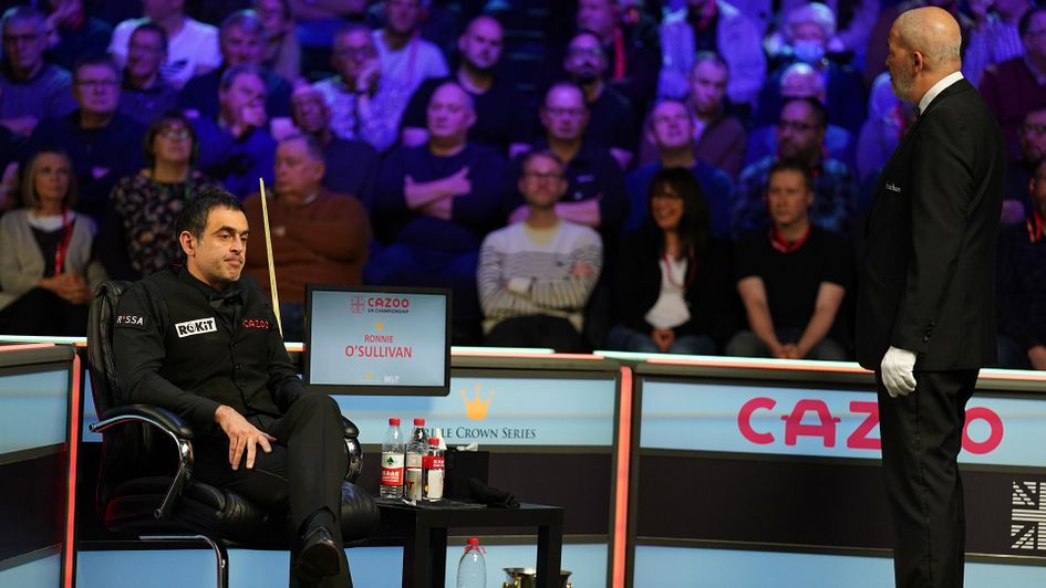 Ronnie O'Sullivan sits in his chair after crowd disturbance