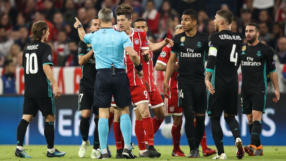 Bayern Munich players argue with the referee in the first leg