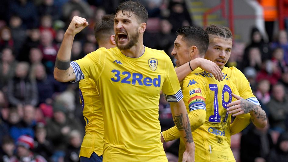 Mateusz Klich and his Leeds team-mates celebrate after taking the lead at Sheff United