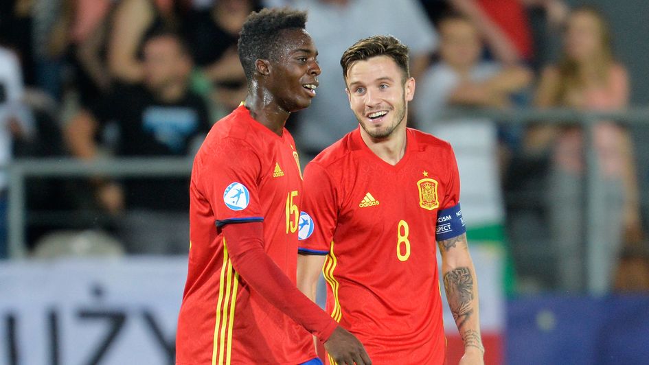 Hat-trick hero Saul Niguez (right)