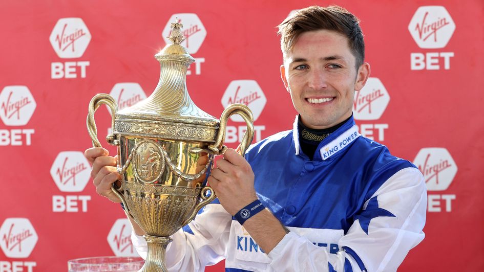 Kevin Stott celebrates with the Virgin Bet Ayr Gold Cup trophy after Bielsa's success