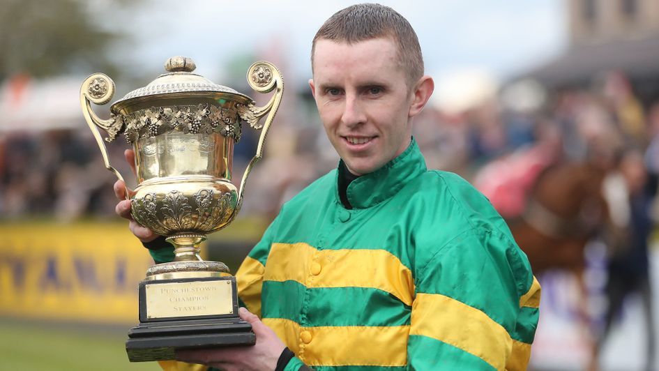 Mark Walsh poses with the trophy after Unowhatimeanharry's win