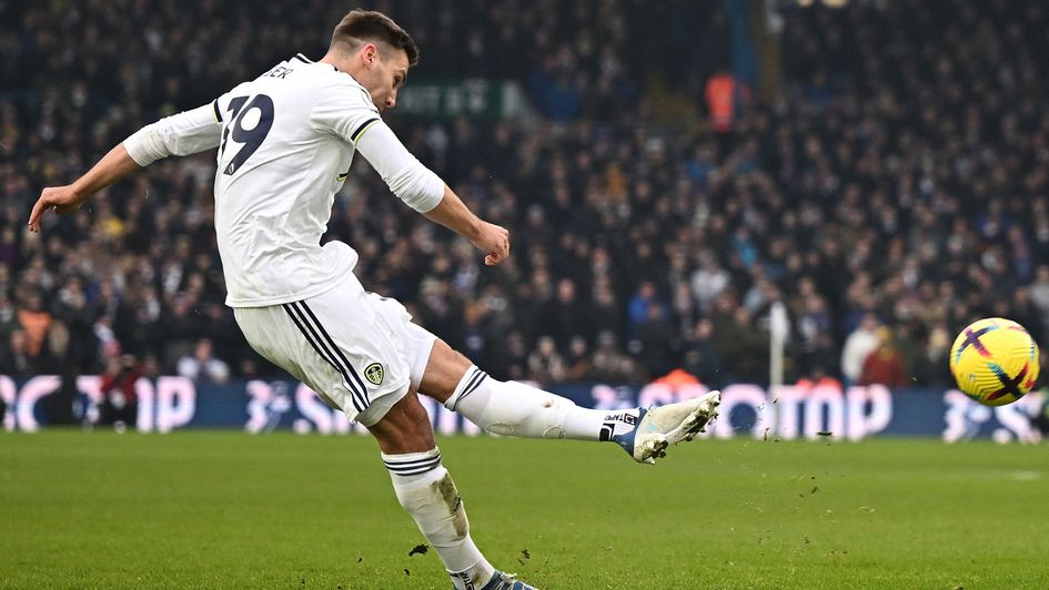 Max Wöber takes a free-kick against Brentford