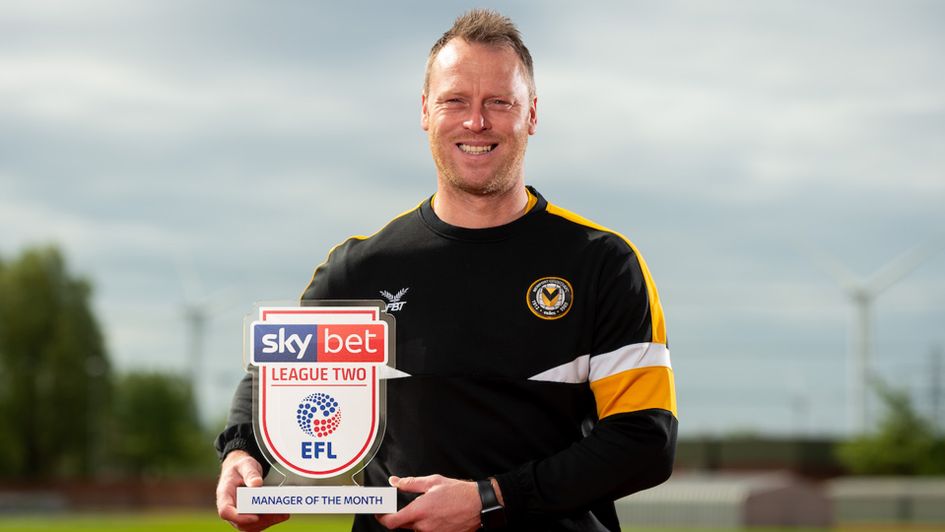 Michael Flynn with the Sky Bet League Two Manager of the Month award for April