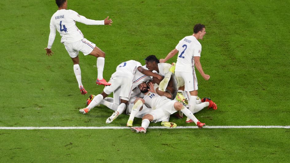 France celebrate completing their comeback win over Belgium