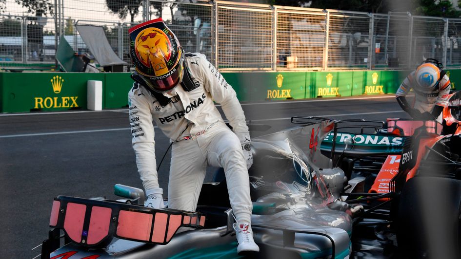 Lewis Hamilton climbs out of his car in Baku
