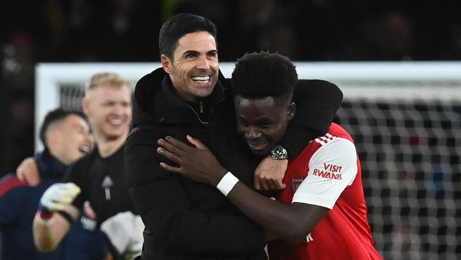 Mikel Arteta and Bukayo Saka celebrate