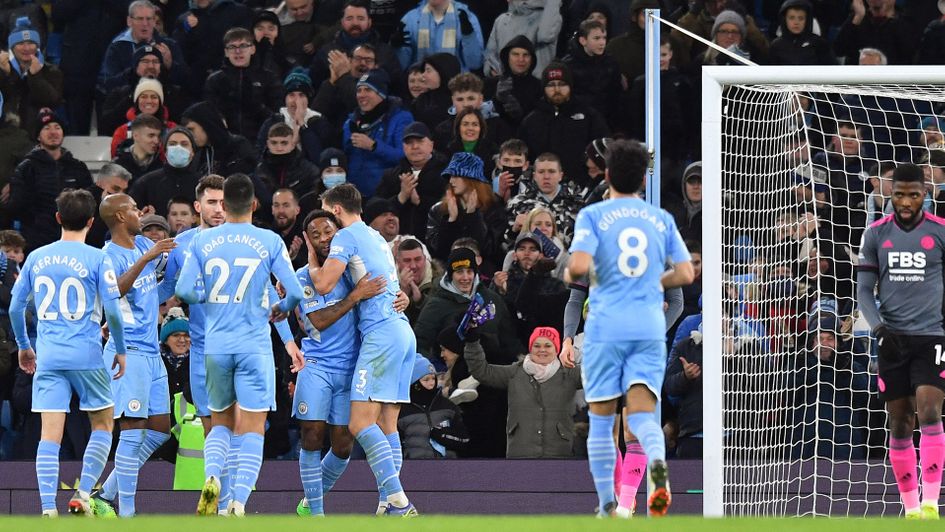 Manchester City celebrate one of their six goals against Leicester