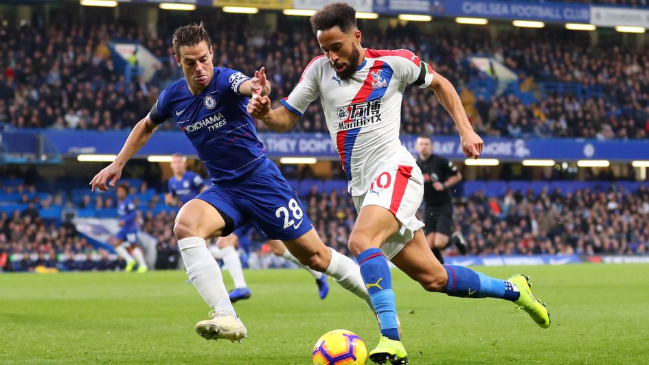 Andros Townsend (right) is challenged by Cesar Azpilicueta