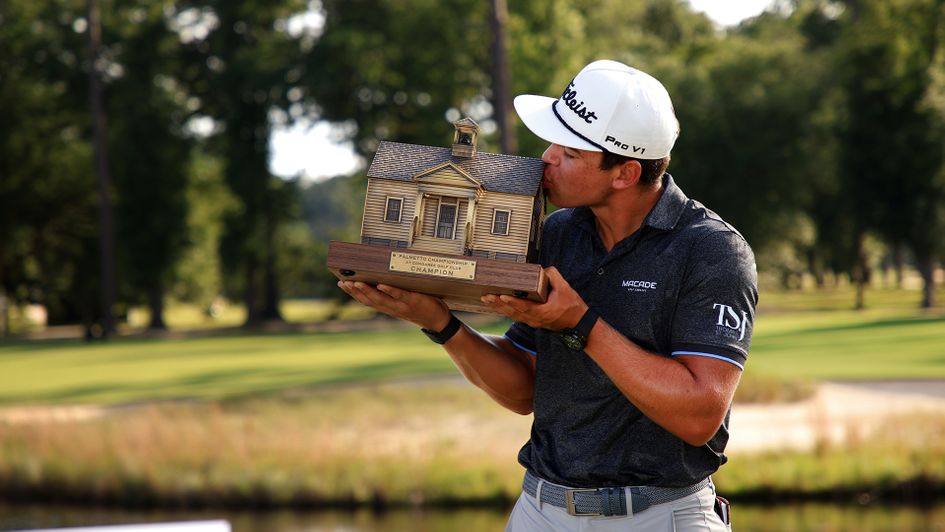 Garrick Higgo poses with the trophy after winning the Palmetto Championship