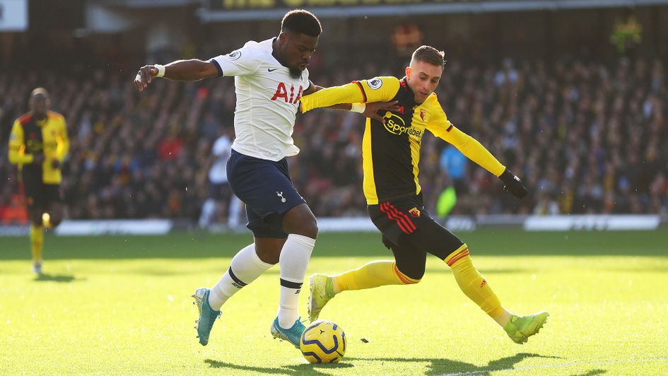 Serge Aurier of Tottenham tackles with Gerard Deulofeu