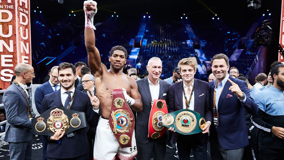 Joe Markowski (next to Eddie Hearn) with Anthony Joshua and his belts (credit Mark Robinson, Matchroom Boxing)