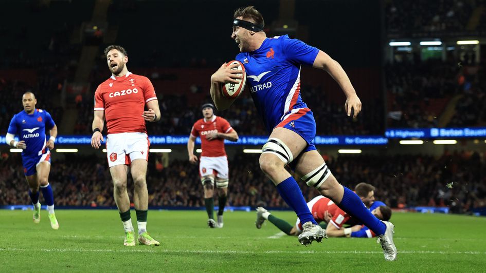 Anthony Jelonch of France scores a try