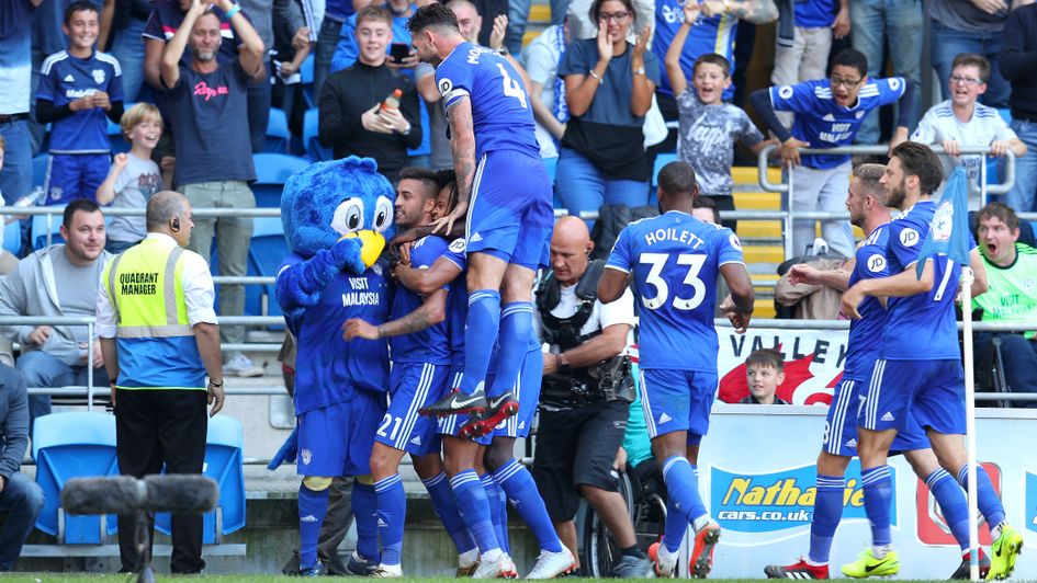 Victor Camarasa celebrates with his team-mates after scoring for Cardiff