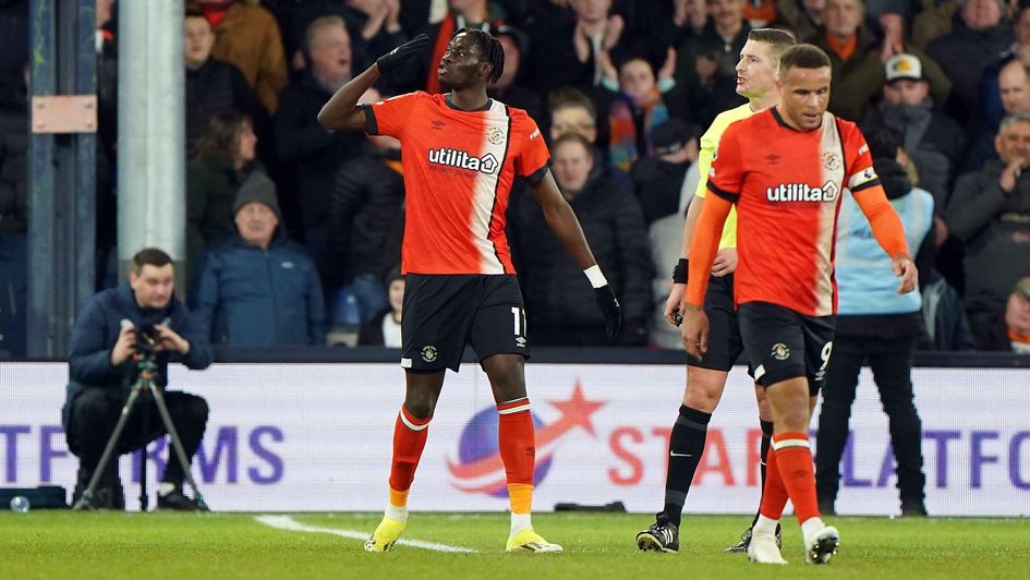 Elijah Adebayo celebrates his hat-trick against Brighton