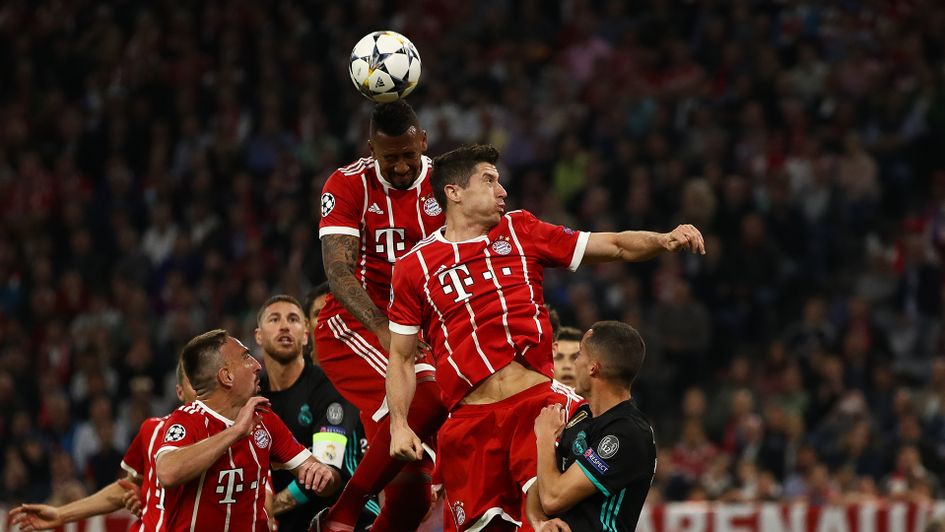 Real Madrid and Bayern Munich challenge for the ball during the first leg