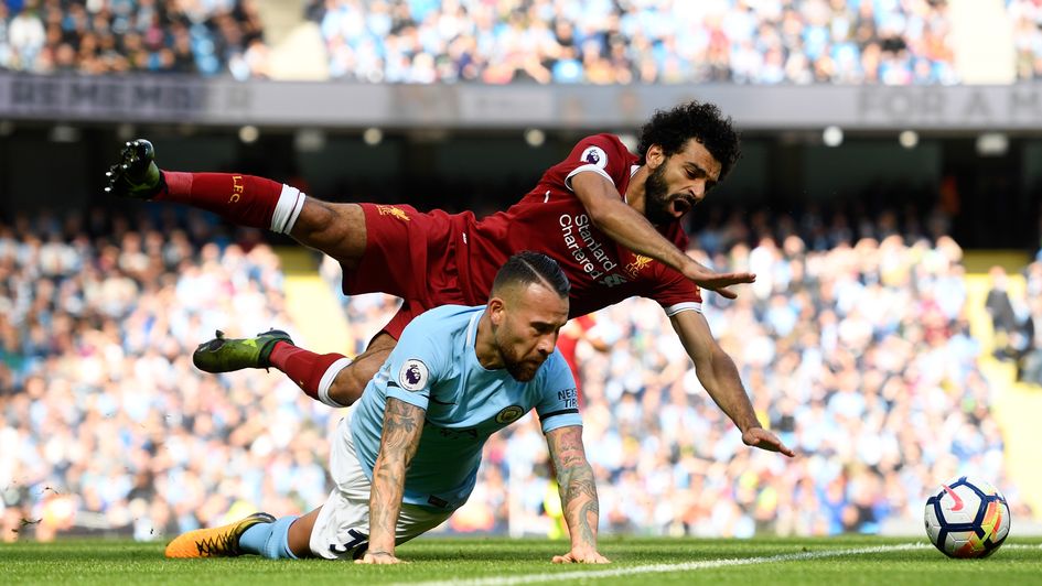 Otamendi (bottom) tackles Salah