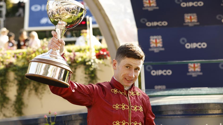 Oisin Murphy lifts the trophy aloft