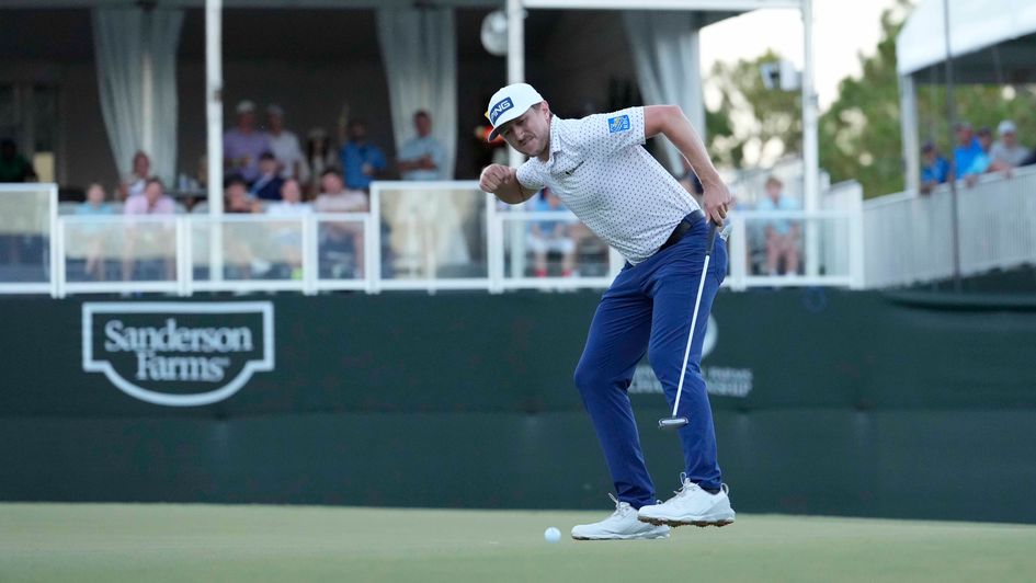 Mackenzie Hughes celebrates as his ball heads for the hole