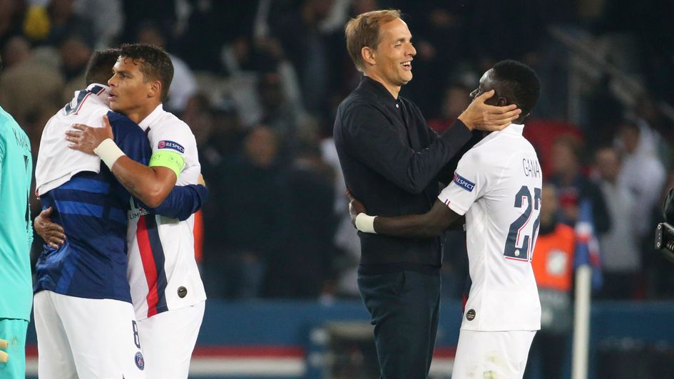 Thomas Tuchel (centre, left): PSG boss celebrates their win over Real Madrid with Idrissa Gueye