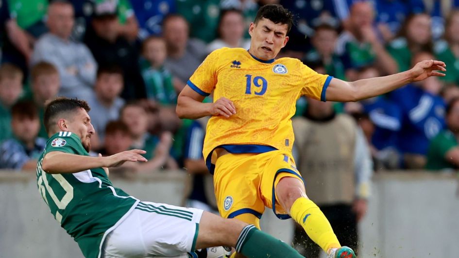 Bakhtiyar Zaynutdinov is tackled by Northern Ireland's Craig Cathcart